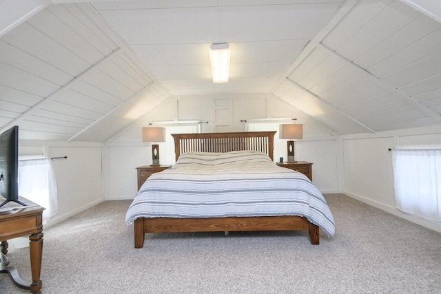 bedroom with light carpet and vaulted ceiling