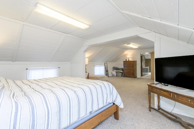 carpeted bedroom featuring lofted ceiling