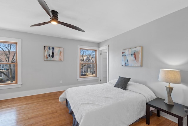 bedroom featuring hardwood / wood-style flooring and ceiling fan