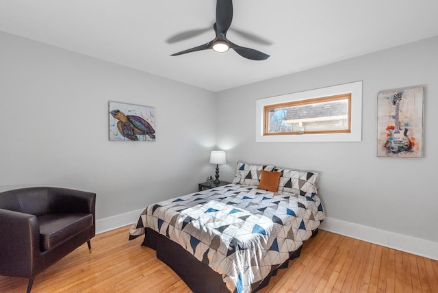 bedroom with ceiling fan and light hardwood / wood-style floors