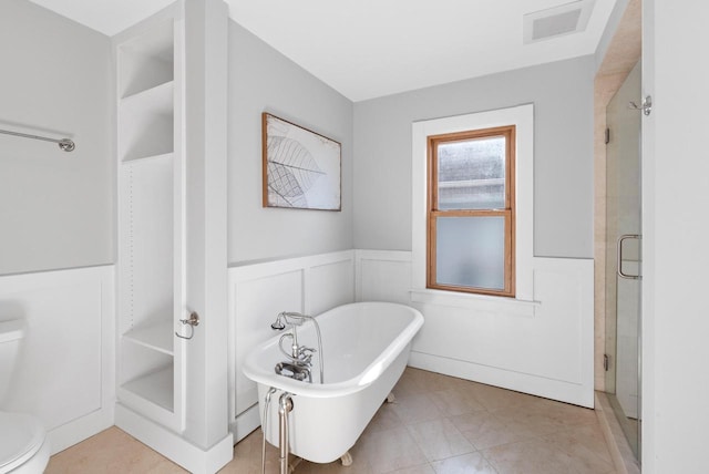 bathroom featuring toilet and a bathing tub