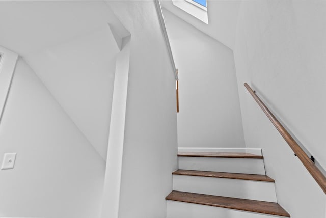 staircase featuring a skylight