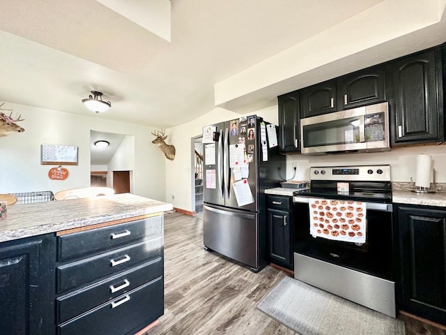 kitchen featuring appliances with stainless steel finishes and light wood-type flooring