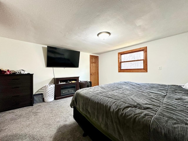 carpeted bedroom with a textured ceiling