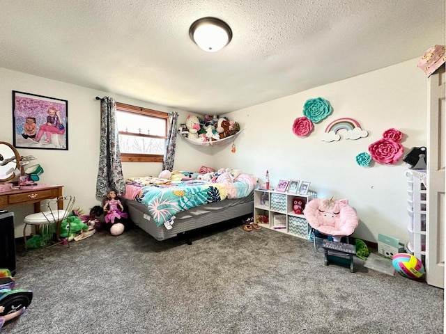 bedroom featuring carpet floors and a textured ceiling