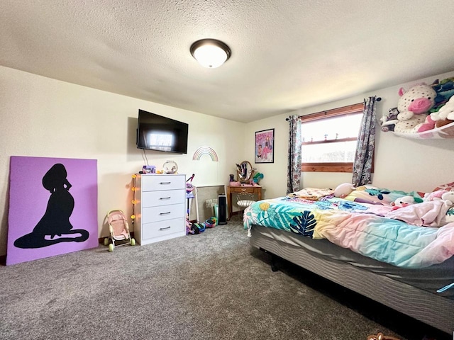 bedroom with carpet floors and a textured ceiling