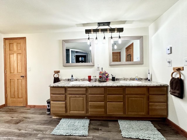 bathroom featuring vanity and hardwood / wood-style floors