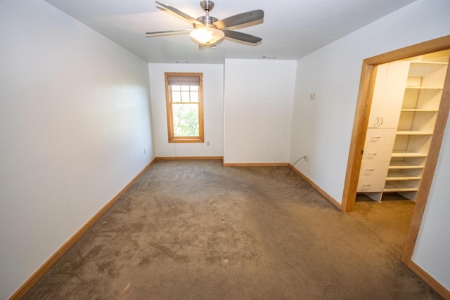 empty room with carpet and ceiling fan