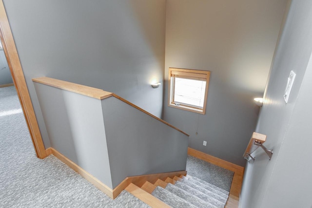 stairway featuring baseboards