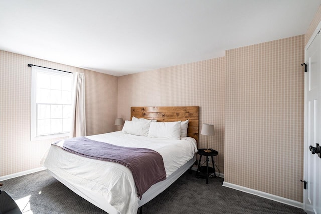 bedroom featuring dark carpet