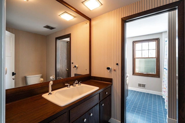 bathroom with vanity and toilet