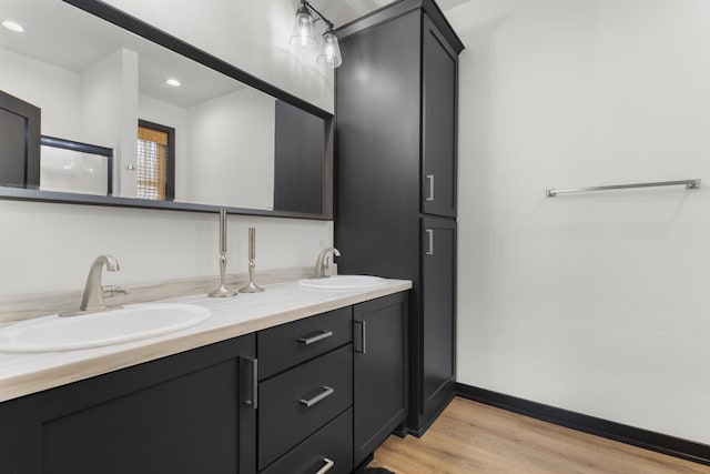 bathroom with vanity and hardwood / wood-style floors