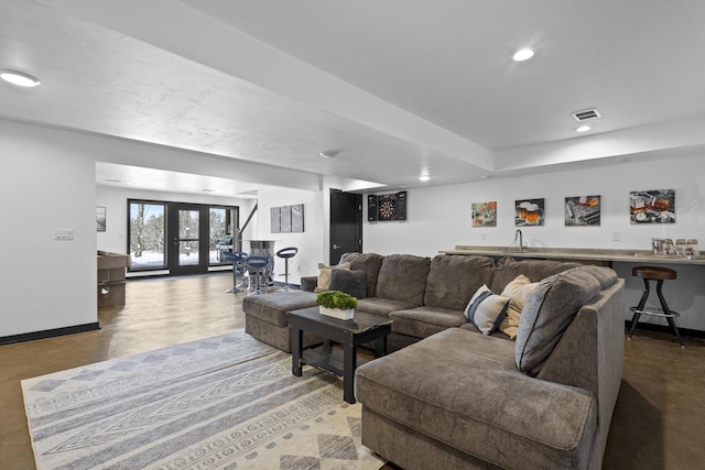 living room featuring french doors and bar area