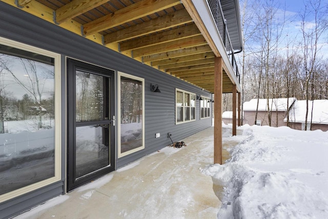 view of snow covered patio