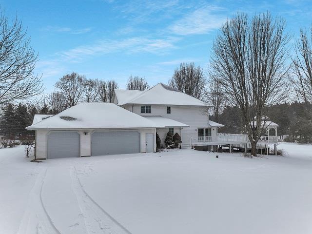 front facade with a garage