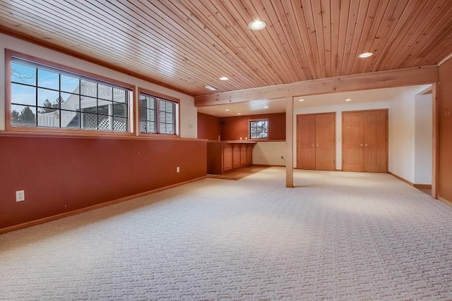 basement featuring light carpet and wood ceiling