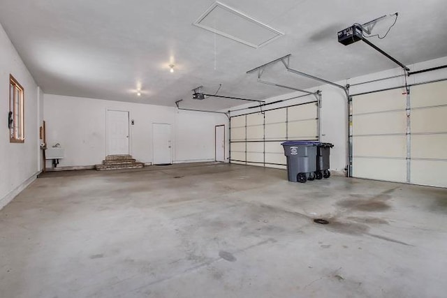 garage with a garage door opener and sink