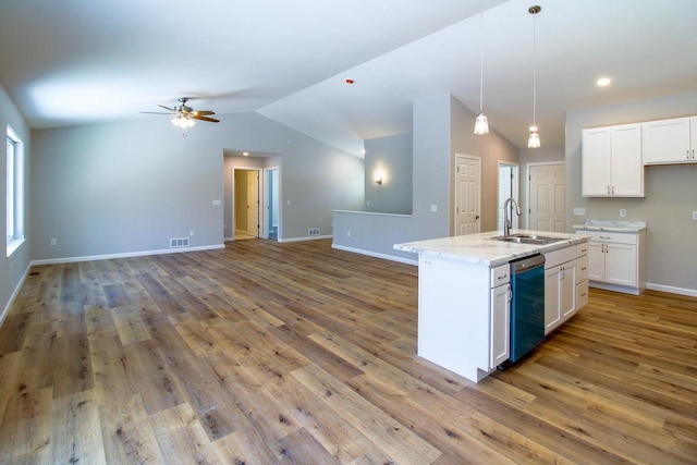 kitchen featuring decorative light fixtures, white cabinetry, sink, a kitchen island with sink, and stainless steel dishwasher