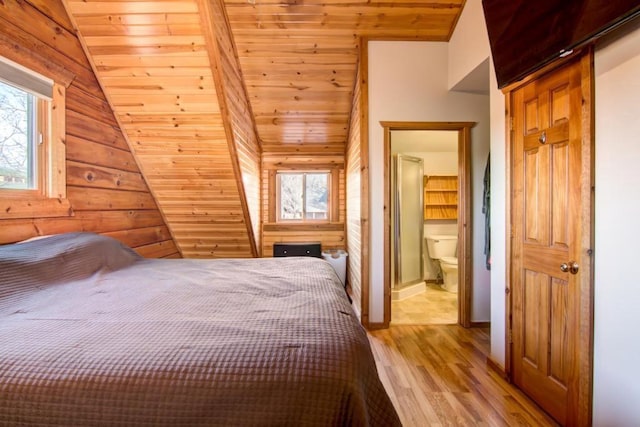 unfurnished bedroom featuring connected bathroom, light hardwood / wood-style flooring, wooden ceiling, and vaulted ceiling