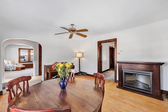 dining area featuring light hardwood / wood-style floors and ceiling fan