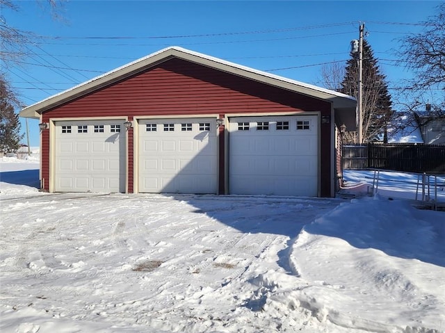 view of snow covered garage