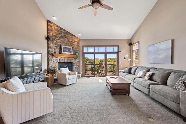 6507 Willow Ct, Waterford, WI 53185 - living room featuring a fireplace, high vaulted ceiling, ceiling fan, and carpet