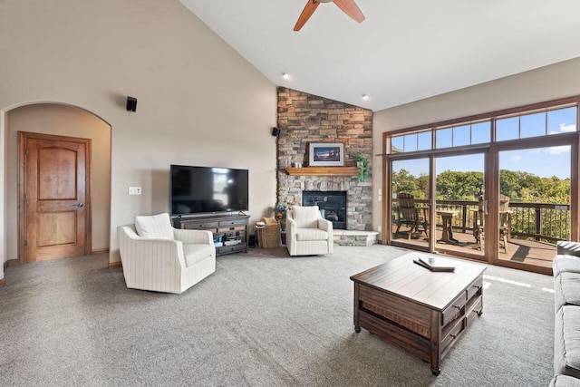6507 Willow Ct, Waterford, WI 53185 - living room featuring a stone fireplace, high vaulted ceiling, and ceiling fan