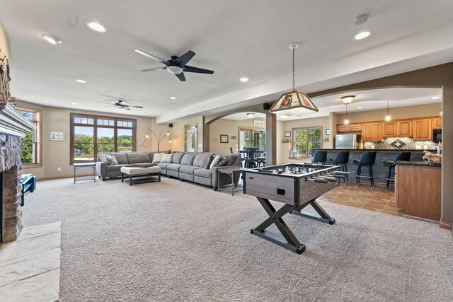 6507 Willow Ct, Waterford, WI 53185 - game room with ceiling fan, a fireplace, and light carpet