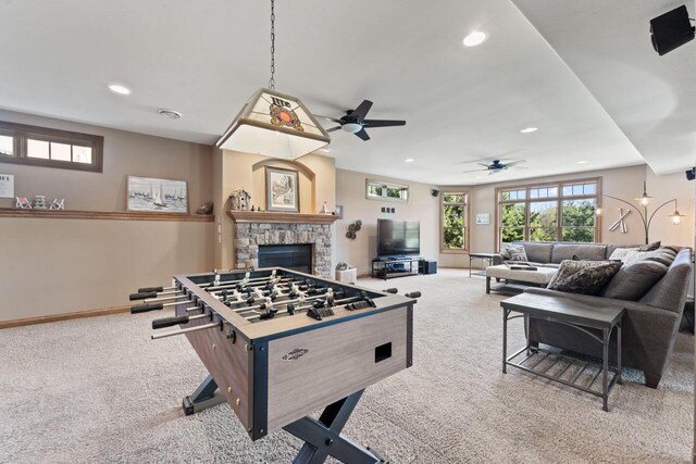 6507 Willow Ct, Waterford, WI 53185 - playroom with a stone fireplace, carpet floors, and a wealth of natural light