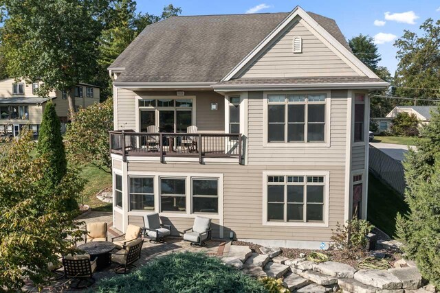 6507 Willow Ct, Waterford, WI 53185 - rear view of house with a patio and a balcony