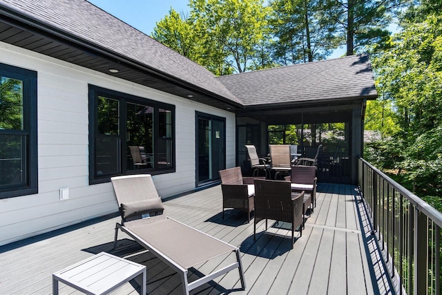 deck with outdoor dining area