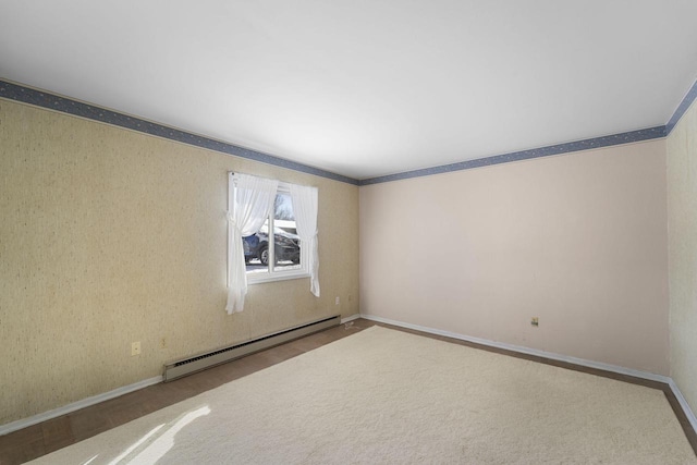 empty room featuring a baseboard heating unit