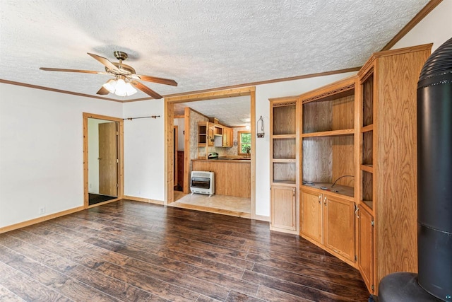 33315 State Highway 13, Bayfield, WI 54814 - unfurnished living room with a textured ceiling, ornamental molding, dark wood-style floors, ceiling fan, and heating unit