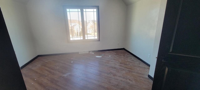 spare room featuring hardwood / wood-style floors