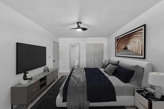 bedroom with a closet, ceiling fan, and dark colored carpet