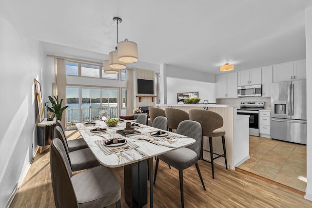 dining space featuring light hardwood / wood-style floors