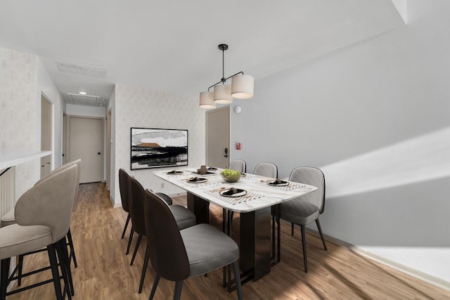 dining area featuring hardwood / wood-style floors