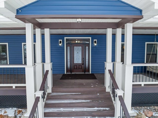 property entrance featuring a porch