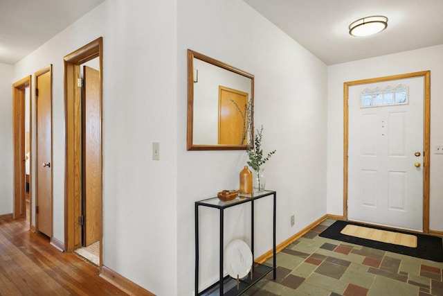 entrance foyer featuring dark hardwood / wood-style floors