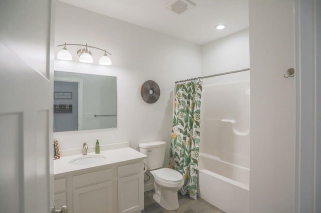 full bathroom featuring vanity, toilet, and shower / bath combo with shower curtain