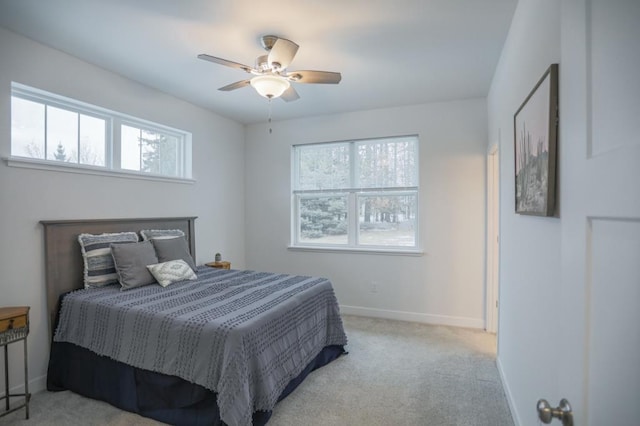 bedroom with light carpet and ceiling fan