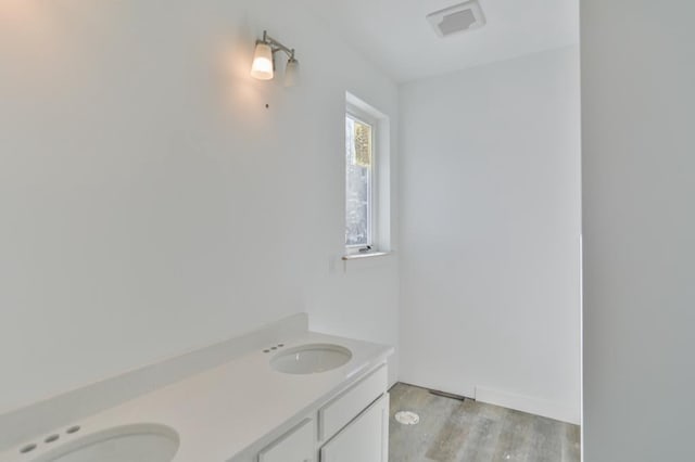 bathroom featuring sink and hardwood / wood-style floors