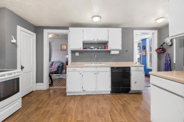 kitchen featuring sink, electric range, black dishwasher, wood-type flooring, and white cabinets