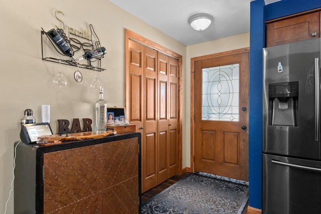 foyer entrance with dark hardwood / wood-style flooring