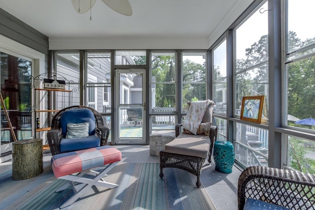 sunroom featuring plenty of natural light and ceiling fan