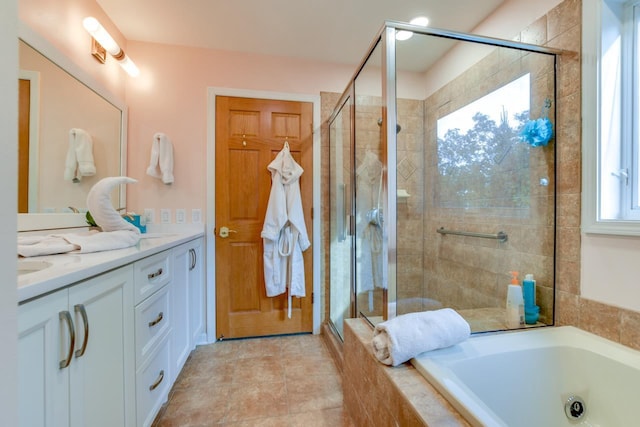 bathroom with vanity and separate shower and tub