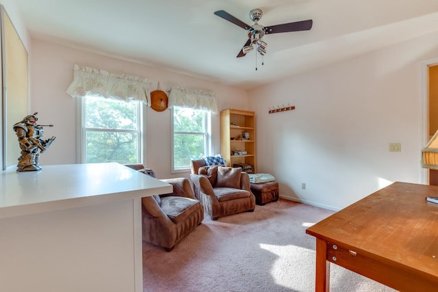 sitting room featuring ceiling fan and carpet flooring