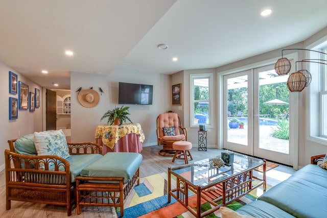 living room featuring light hardwood / wood-style floors and french doors