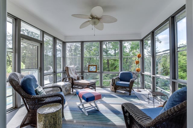 sunroom / solarium featuring ceiling fan and a healthy amount of sunlight