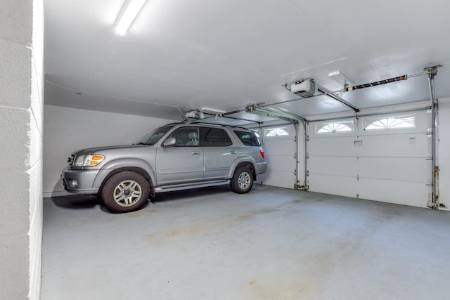 garage featuring a garage door opener